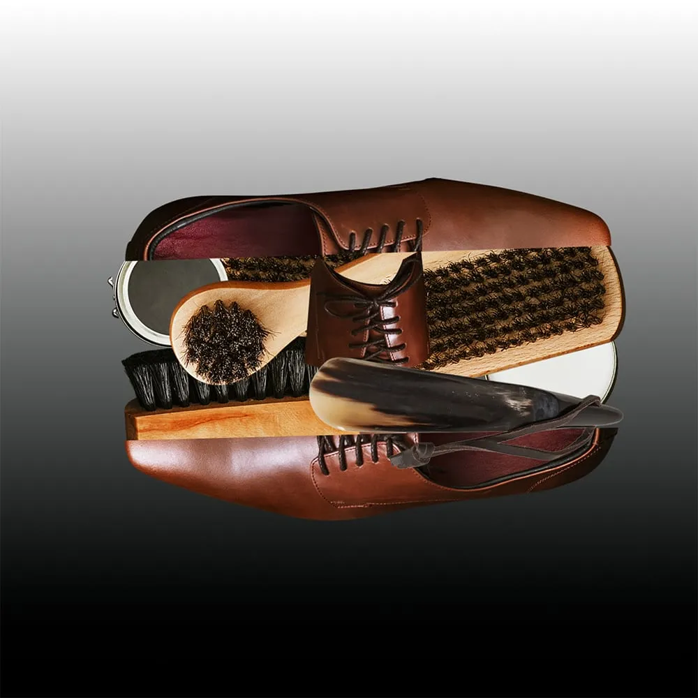 Shoe store. A shoe dissected and recombined with brushes and polished surfaces, shifting the object from function to form. Digital collage by Asya Aseeva